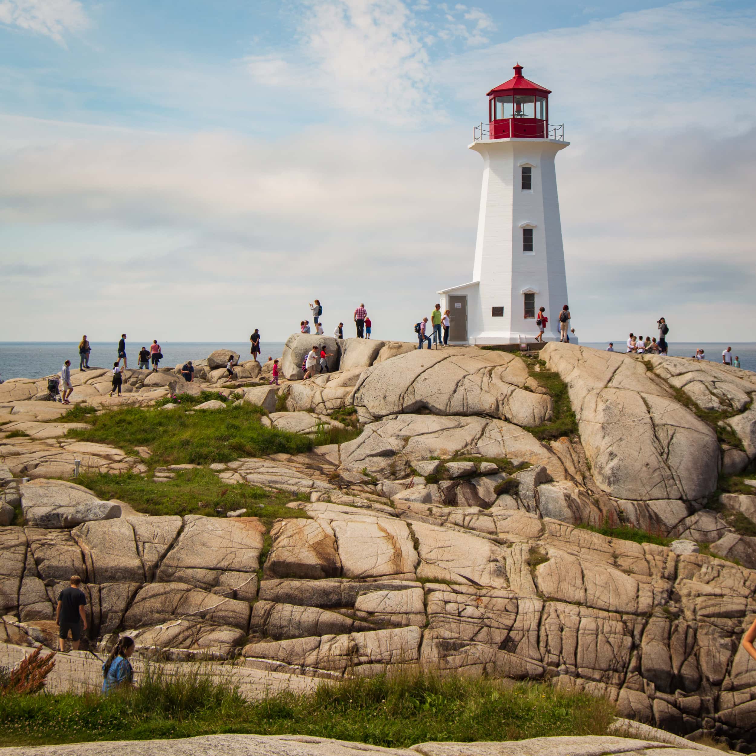 The Lighthouse of Peggy's Cove by the water