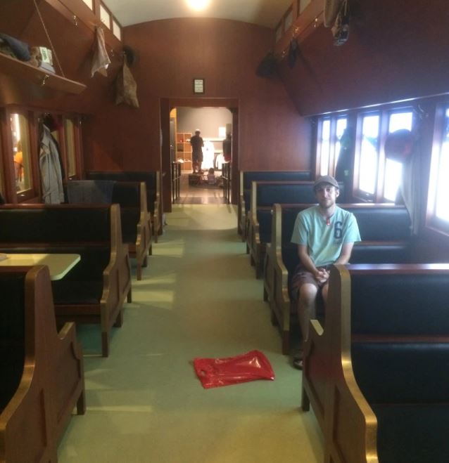 Ryan sitting in train wagon